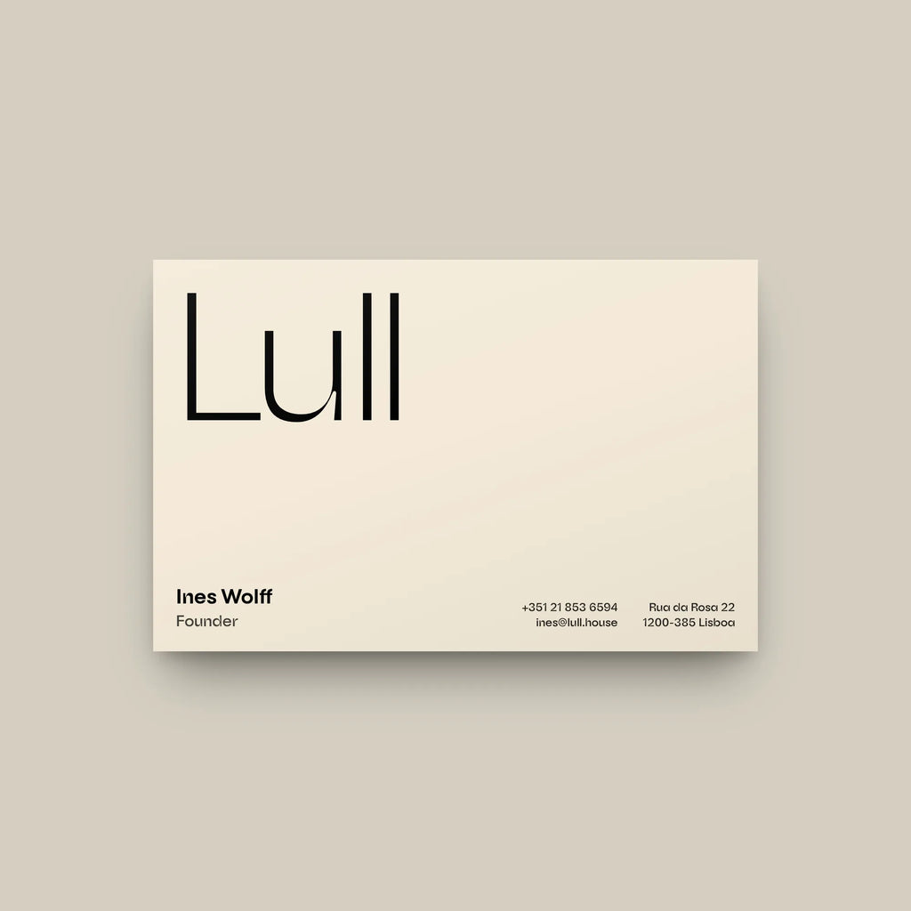Auria wavy sans on a business card for a pool house: brand name in the light weight, name, title and contact lines