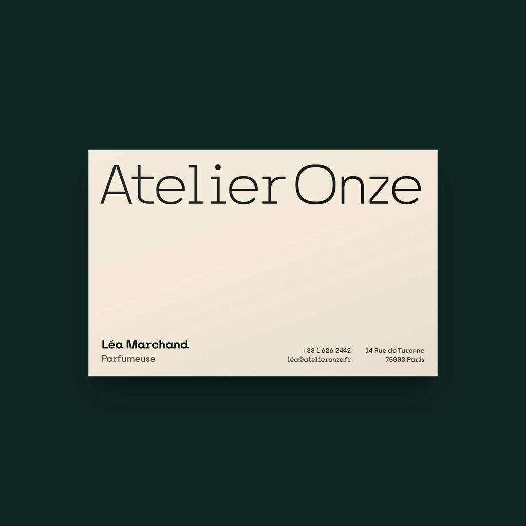 Nano bold slab serif on a business card for a perfume atelier: brand name in the light weight, name, title and contact lines