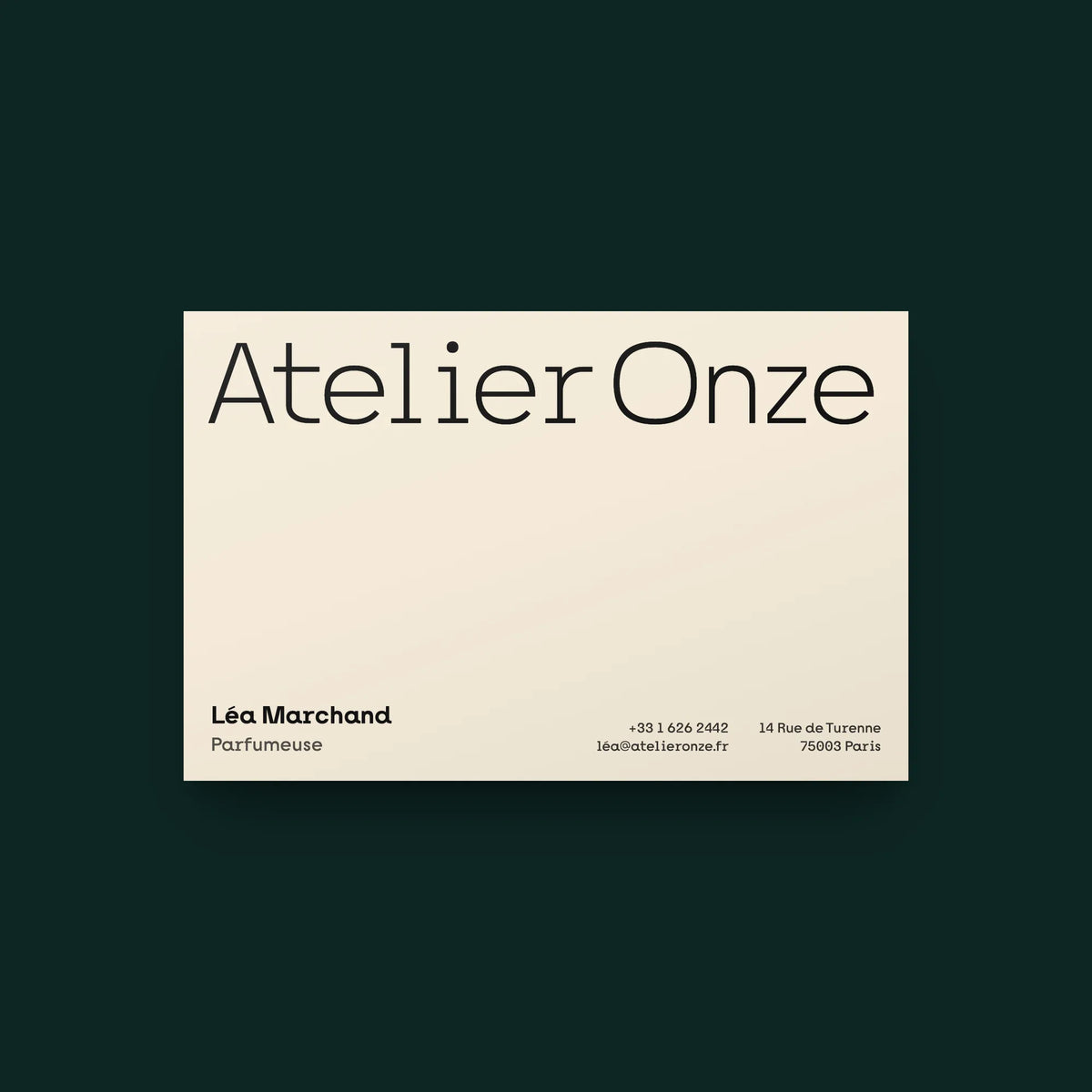 Nano bold slab serif on a business card for a perfume atelier: brand name in the light weight, name, title and contact lines
